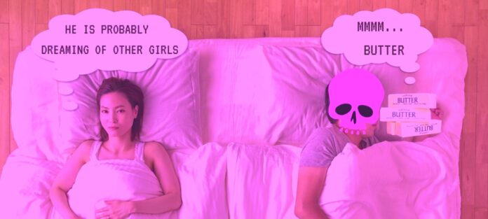 Two people under the covers with butter
